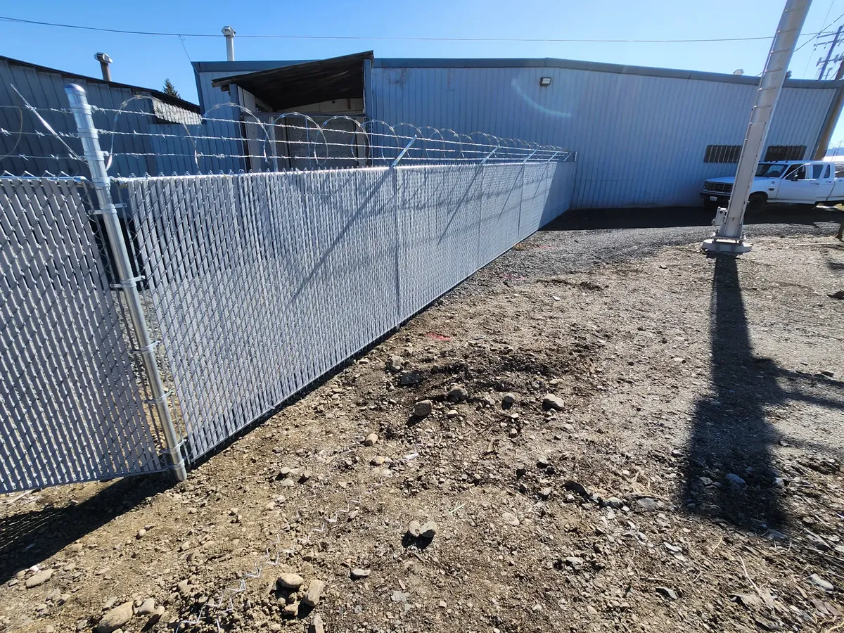 High Performance Chain Link With Privacy Slats And Concertina Wire in Newman Lake, WA
