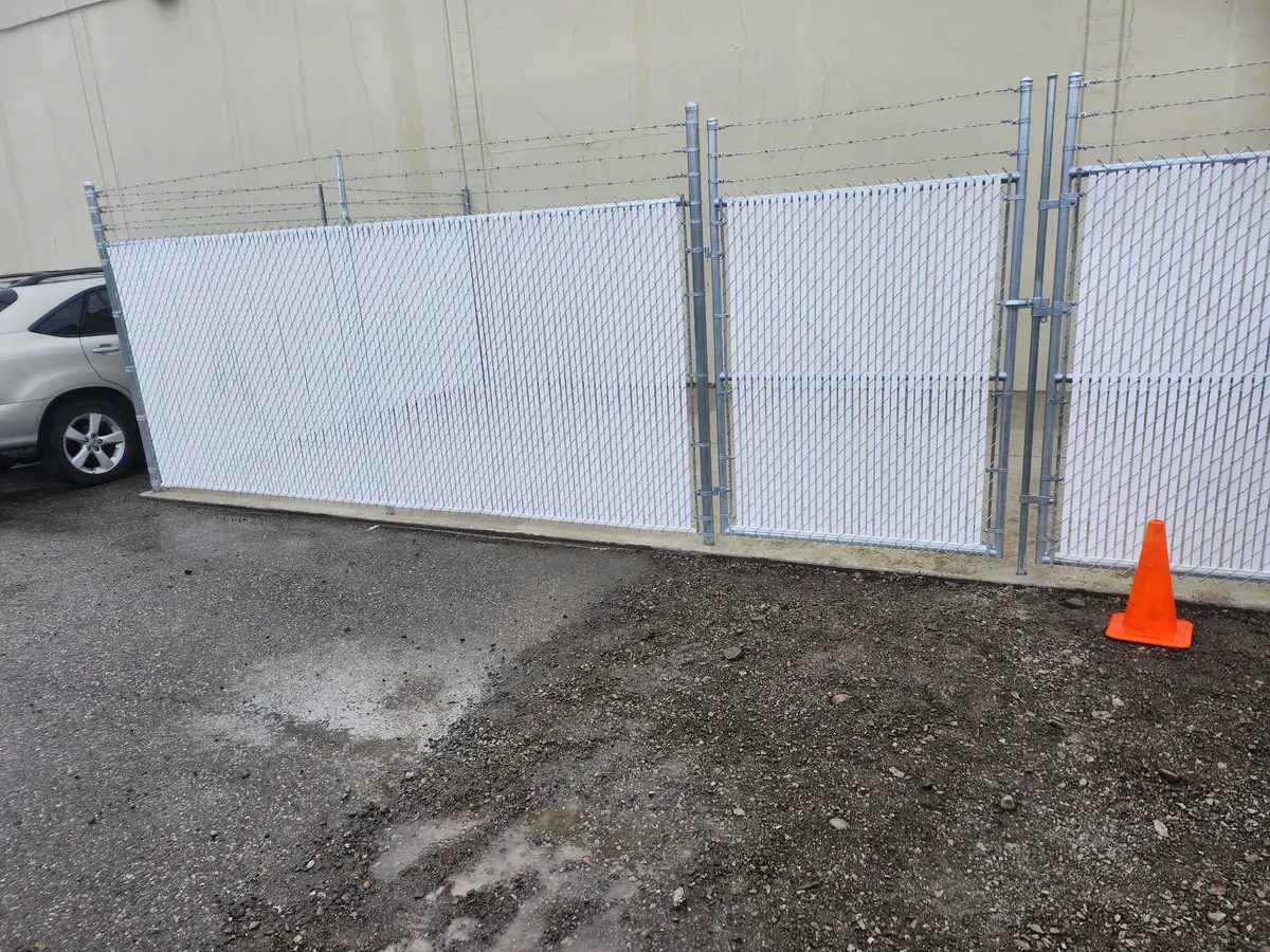 Purpose Built Chain Linkwith Barb Wireand Privacy Slats in Liberty Lake, WA