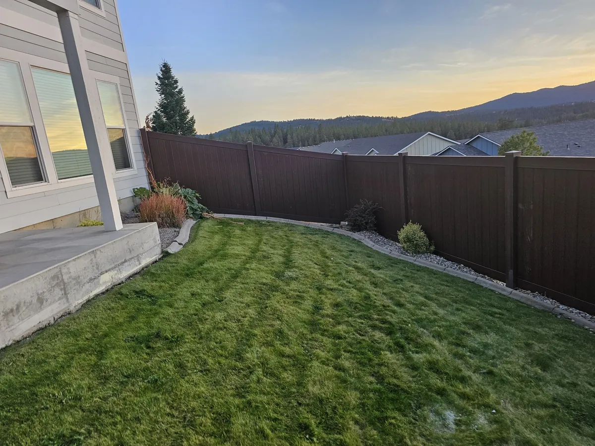 Trusted Wood Grain Vinyl Privacy Fence in Post Falls, ID